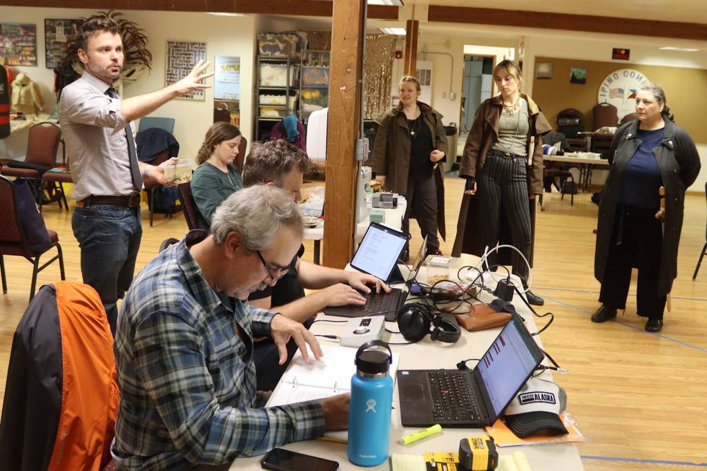 James Palmer (left), director of Henry V for Theater Alaska, offers direction to actors and crew during a rehearsal Wednesday at the Filipino Community Hall. (Mark Sabbatini / Juneau Empire)