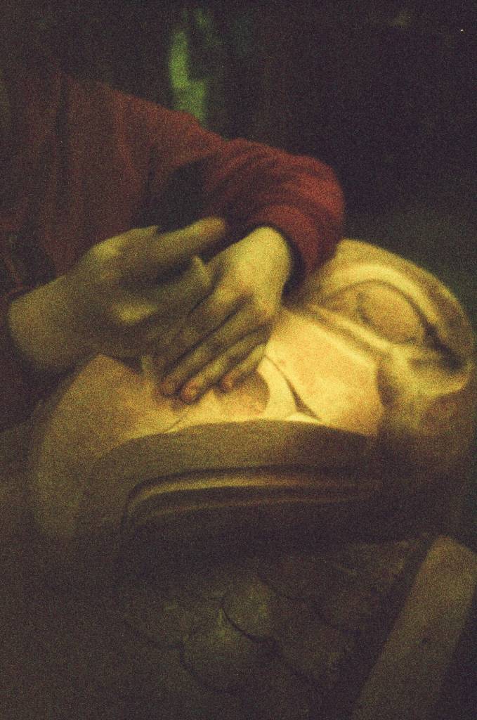 In Jon Rowan Jr.s Klawock carving studio, his apprentice Lea Armour carves an eagle at the top of a totem dedicated to remembering missing and murdered Indigenous relatives. (Photo by Addy Mallott)