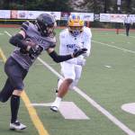 Johnathyn Kestel runs a first-quarter catch inside the Bartlett High School 10-yard line during the first quarter of Saturdays game at Adair-Kennedy Memorial Park. (32) (Mark Sabbatini / Juneau Empire)
