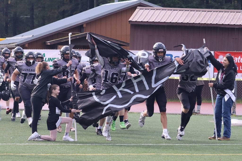 The Juneau Huskies enter the field for the second half leading Bartlett High School 20-8 in Saturdays game at Adair-Kennedy Memorial Park. (Mark Sabbatini / Juneau Empire)