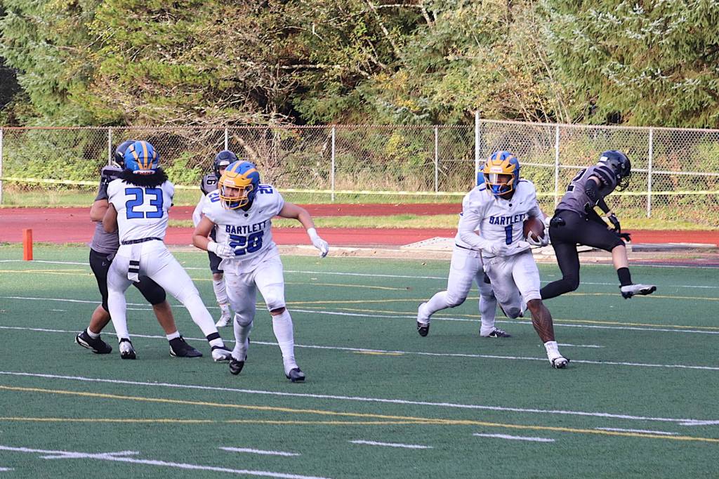 Bartlett High Schools Andre Jameson (1) takes a fumble he recovered at his teams 5-yard line the length of the field for a touchdown during Saturdays game against Juneau-Douglas High School: Yadaa.at Kalé at Adair-Kennedy Memorial Park. (Mark Sabbatini / Juneau Empire)