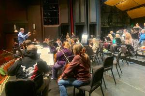 Dwayne Corbin, one of four candidates to become the new music director of the Juneau Symphony, conducts the orchestra during a rehearsal Tuesday for this weekends concerts at Juneau-Douglas High School: Yadaa.at Kalé. (Mark Sabbatini / Juneau Empire)