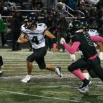 Juneau Huskies senior Jayden Johnson (4) runs for a 51-yard touchdown midway through the first quarter of Friday nights game against Colony High School in Palmer. Johnson scored five touchdowns in the first half as Juneau defeated Colony 42-6. (Klas Stolpe / Juneau Empire)