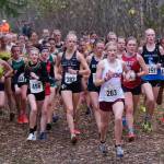 The Division I girls begin their first loop during the 2024 ASAA cross-country running state championships Saturday on the Bartlett High School Trails in Anchorage. (Klas Stolpe / Juneau Empire)