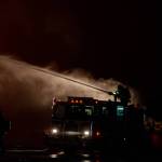 A Haines volunteer firefighter works on a massive blaze on Saturday, Oct. 5, 2024 in Haines. (Rashah Mcchesney/Chilkat Valley News)