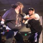 James Roberts (left), at 342 pounds, takes on 277-pound Eric Ashenfelter in the heavyweight match of the night during AK Beatdown 36 on Saturday night at Elizabeth Peratrovich Hall. (Mark Sabbatini / Juneau Empire)