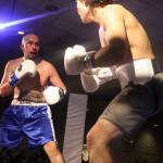 Seth Elisoff (left) fights despite a bloody nose against Nickolas Daniels during AK Beatdown 36 on Saturday night at Elizabeth Peratrovich Hall. (Mark Sabbatini / Juneau Empire)