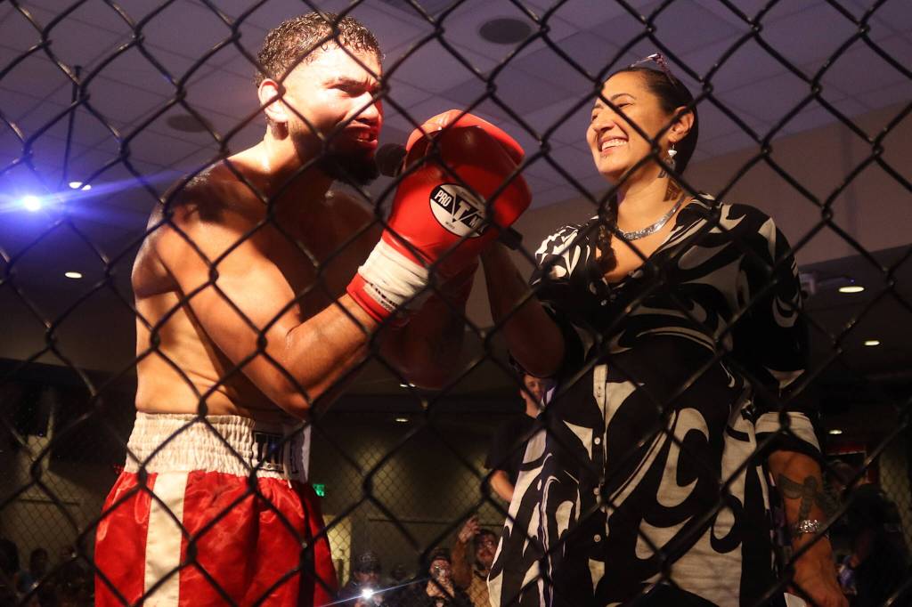 Marco Reina, being interviewed by AK Beatdown 36 announcer Jamiann Seiltin, offers thanks to supporters and the crowd after defeating Tyson Duckworth in their boxing match Saturday night at Elizabeth Peratrovich Hall. (Mark Sabbatini / Juneau Empire)