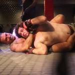 Scott Haas puts Duncan Meyer in a headlock during their MMA bout to open AK Beatdown 36 on Saturday night at Elizabeth Peratrovich Hall. (Mark Sabbatini / Juneau Empire)