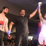 An exhausted Michael Friedricks is declared the winner over Brian McFadden in their MMA bout during AK Beatdown 36 on Saturday night at Elizabeth Peratrovich Hall. (Mark Sabbatini / Juneau Empire)