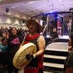 Colin Rose enters the ring with traditional regalia, chants and dance during AK Beatdown 36 on Saturday night at Elizabeth Peratrovich Hall. (Mark Sabbatini / Juneau Empire)