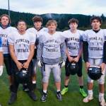 Juneau Huskies linemen (left-to-right) senior Ricky Tupou, senior Gunnar Tarver, junior Walter Haube-Law, junior Jonah Mahle, junior Kyle Carter, senior Merrick Hartman, senior Stefano Rivera and junior Hyrum Fish. (Klas Stolpe / Juneau Empire)