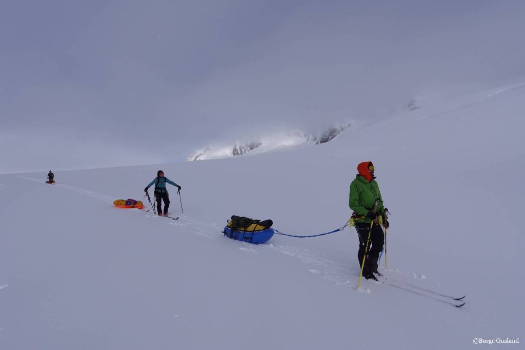 Vincent Colliard, Sarah McNair-Landry and Erik Boomer ski through a snowy section of the Juneau Icefield. (Børge Ousland / Copyright photo used with permission)