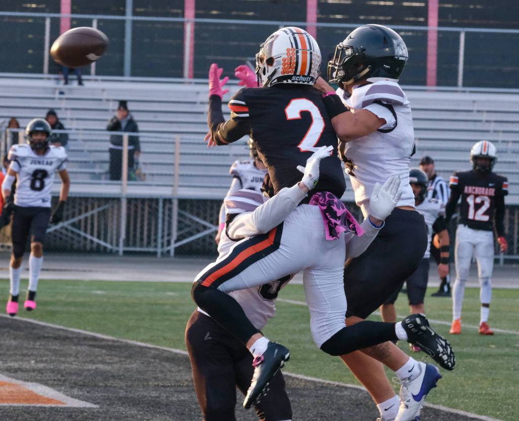 Juneau Huskies senior Sage Schultz and senior Jayden Johnson break up a pass to West Anchorage senior Ariel Sanchez (2) during the Huskies 20-13 loss to the Eagles in the 2024 ASAA State Football Playoffs on Saturday at West Anchorages Nest on Hillcrest. (Klas Stolpe/Juneau Empire)