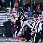Juneau Huskies senior tight end Johnathyn Kestel catches a pass over West Anchorage junior defensive back Talon Copeland (12) during the Huskies 20-13 loss to the Eagles in the 2024 ASAA State Football Playoffs on Saturday at West Anchorages Nest on Hillcrest. (Klas Stolpe/Juneau Empire)