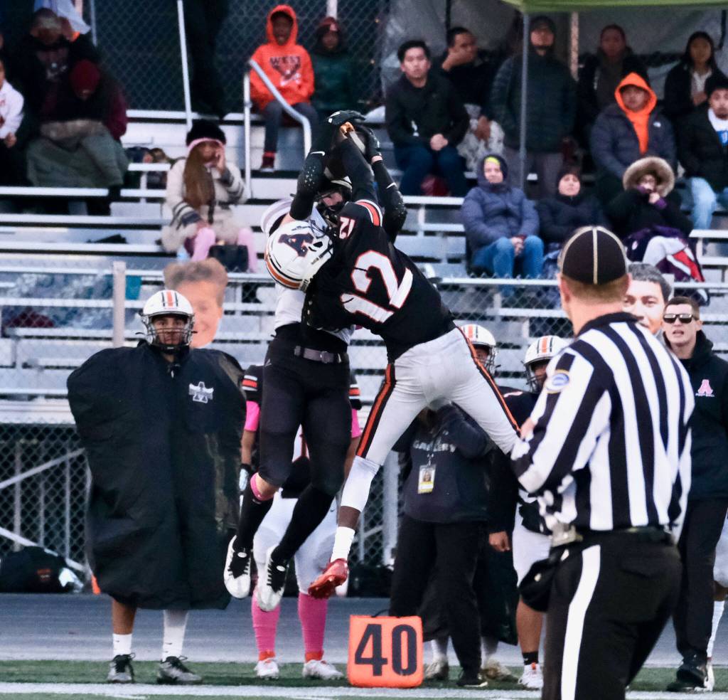 Juneau Huskies senior tight end Johnathyn Kestel catches a pass over West Anchorage junior defensive back Talon Copeland (12) during the Huskies 20-13 loss to the Eagles in the 2024 ASAA State Football Playoffs on Saturday at West Anchorages Nest on Hillcrest. (Klas Stolpe/Juneau Empire)