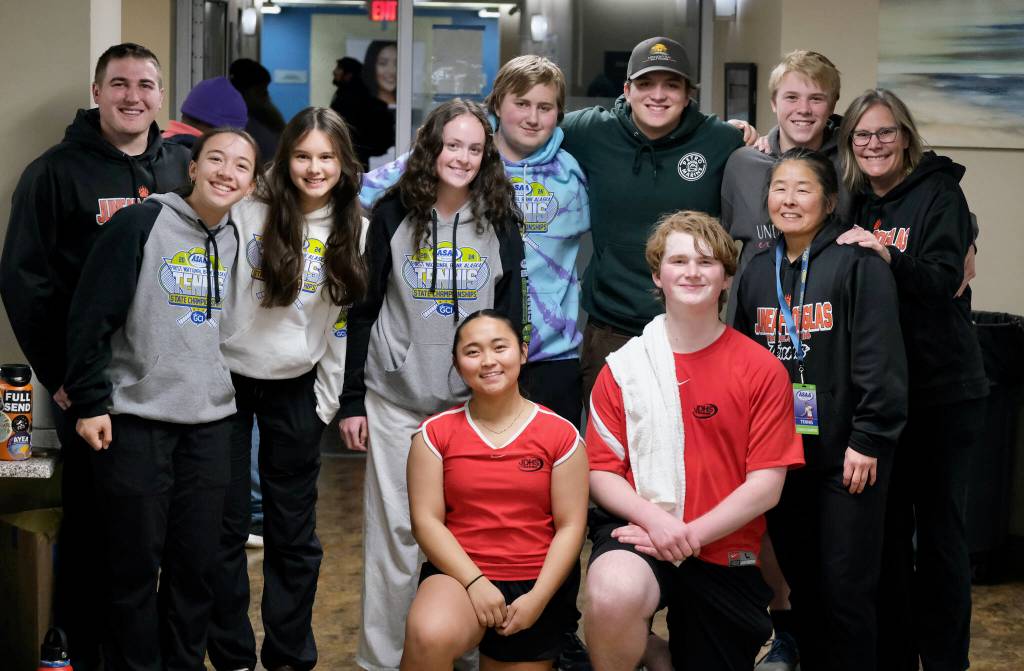 The Juneau-Douglas High School: Yadaa.at Kalé tennis team pose for a photo after their final match on Saturday at the 2024 ASAA State Tennis Championships in Anchorage. (Klas Stolpe/Juneau Empire)