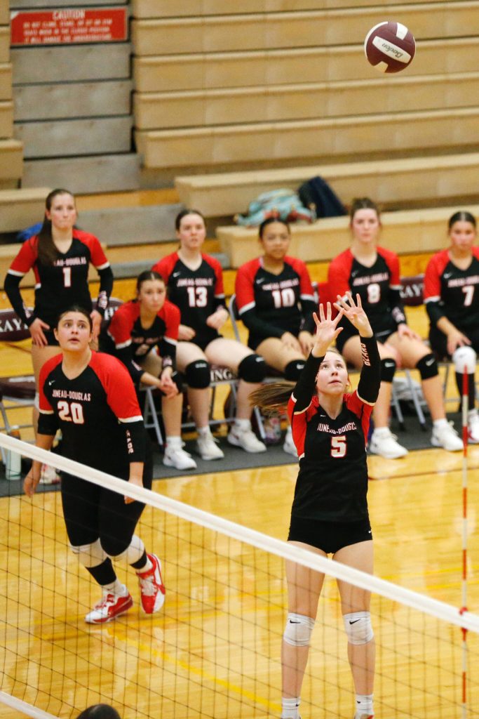 Juneau-Douglas High School: Yadaa.at Kalés Brie Powers sets the ball during their 25-15, 25-21, 25- 18 victory over Ketchikan High School at the Clarke Cochrane Gymnasium on Friday, Oct. 11, 2024. (Christopher Mullen/ Ketchikan Daily News)