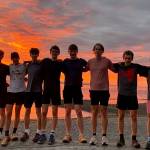 Members of the Juneau-Douglas High School: Yadaa.at Kalé cross-country team pose for a photo while attending the Nike Hole In The Wall XC Invitational at Lakewood High School in Washington. (Photo courtesy JDHS Cross-Country)