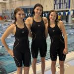 Glacier Swim Club athletes (left-to-right) Lily Francies, Emma Fellman and Valerie Peimann pose during a GSC practice. The three just competed in the Lake Oswego Swim Club Fall Open in Oregon over the weekend. (Photo courtesy Glacier Swim Club)