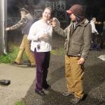 Gabriel Katzeek (right), among the people staying at the citys cold-weather emergency shelter Tuesday night, inspects Halloween-themed earrings worn by Jennifer Skinner, deputy director at St. Vincent de Paul Juneau, during a smoking break. The nonprofit is operating the shelter under a contract with the city. (Mark Sabbatini / Juneau Empire)