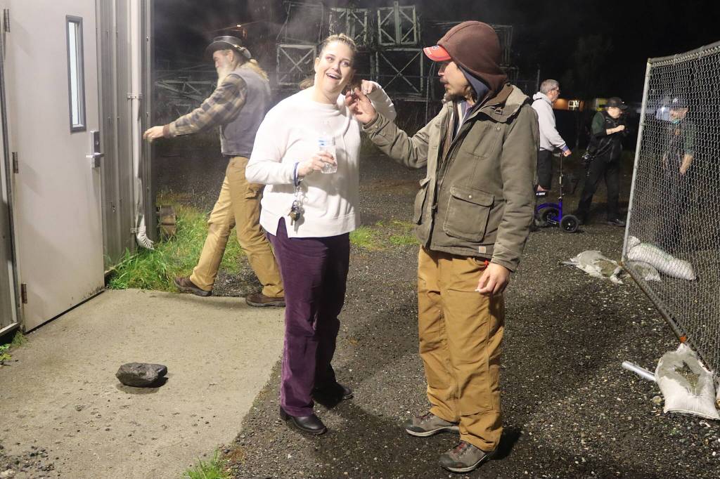 Gabriel Katzeek (right), among the people staying at the citys cold-weather emergency shelter Tuesday night, inspects Halloween-themed earrings worn by Jennifer Skinner, deputy director at St. Vincent de Paul Juneau, during a smoking break. The nonprofit is operating the shelter under a contract with the city. (Mark Sabbatini / Juneau Empire)
