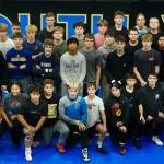 Members of the Juneau-Douglas High School: Yadaa.at Kalé Crimson Bears wrestling team are shown at the Juneau Wrestling Center during practice on Wednesday. (Klas Stolpe/Juneau Empire)