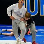 Senior Noah Johnson and freshman Caleb Aube wrestle during JDHS practice. during the Juneau-Douglas High School: Yadaa.at Kalé Crimson Bears wrestling team practice on Wednesday. (Klas Stolpe/Juneau Empire)
