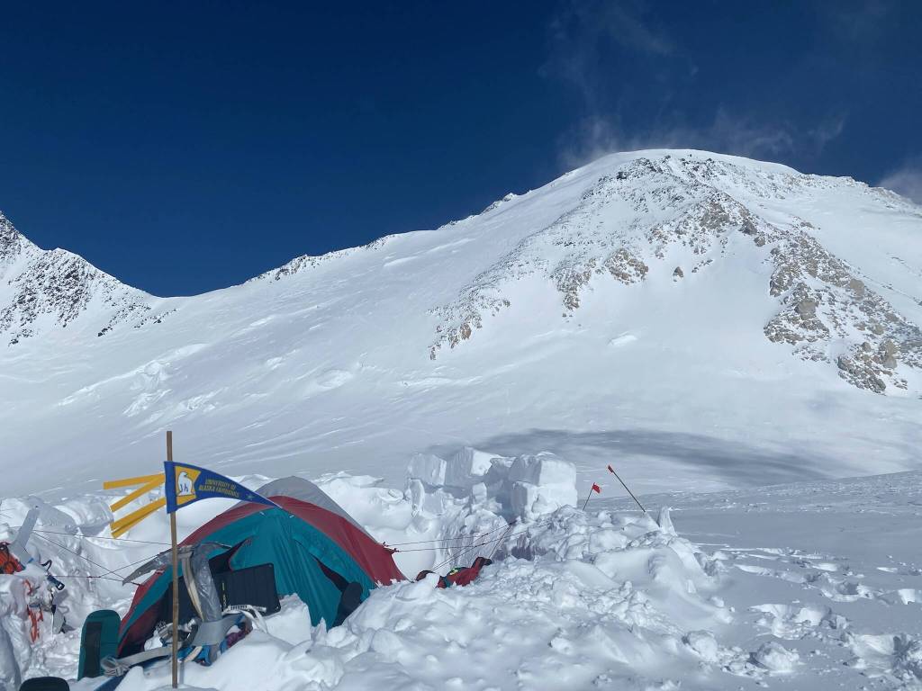 Snow blows near the summit of Denali, upper left, in this photograph from the 17,000-foot camp of Matthew Crisafi-Lurtsema and Roger Jaramillo. (Photo by Matthew Crisafi-Lurtsema)