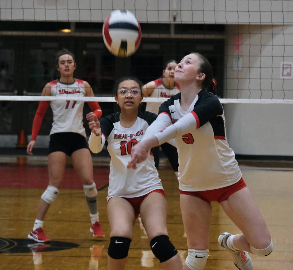 Juneau-Douglas High School: Yadaa.at Kalé sophomore Brie Powers (5) plays a ball as senior Nina Jeter (10) looks on against Wasilla on Friday. (Klas Stolpe/Juneau Empire)