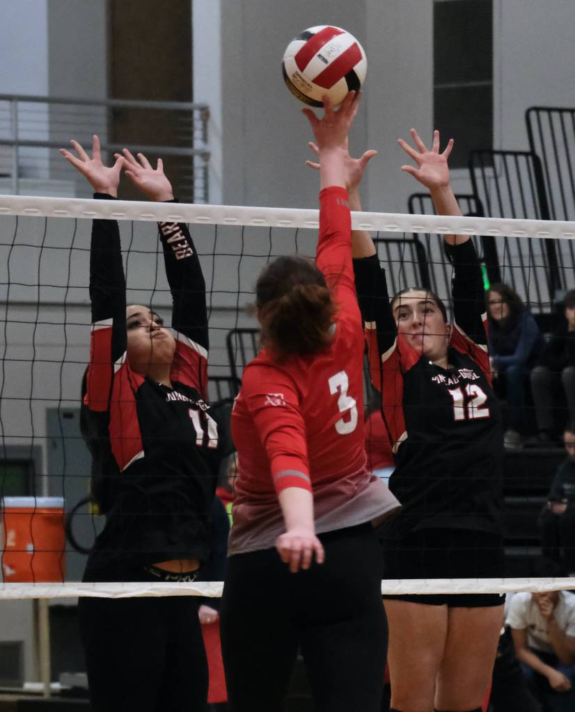 Juneau-Douglas High School: Yadaa.at Kalé juniors Lavinia Maake (11) and Neela Thomas (12) play a tip by Wasilla junior Mia Caldwell (3) during the Crimson Bears three-set loss to the visiting Warriors on Saturday at the George Houston Gymnasium. (Klas Stolpe/Juneau Empire)