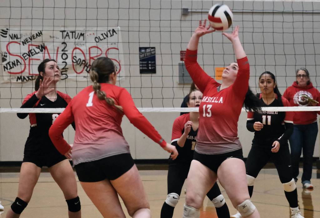 Juneau-Douglas High School: Yadaa.at Kalé senior Evelyn Richards (8), sophomore June Troxel (1) and junior Lavinia Maake (11) prepare as Wasilla senior Hayden Caldera (13) sets for classmate Layla Hays (1) during the Crimson Bears three-set loss Saturday to the visiting Warriors at George Houston Gymnasium. (Klas Stolpe/Juneau Empire)