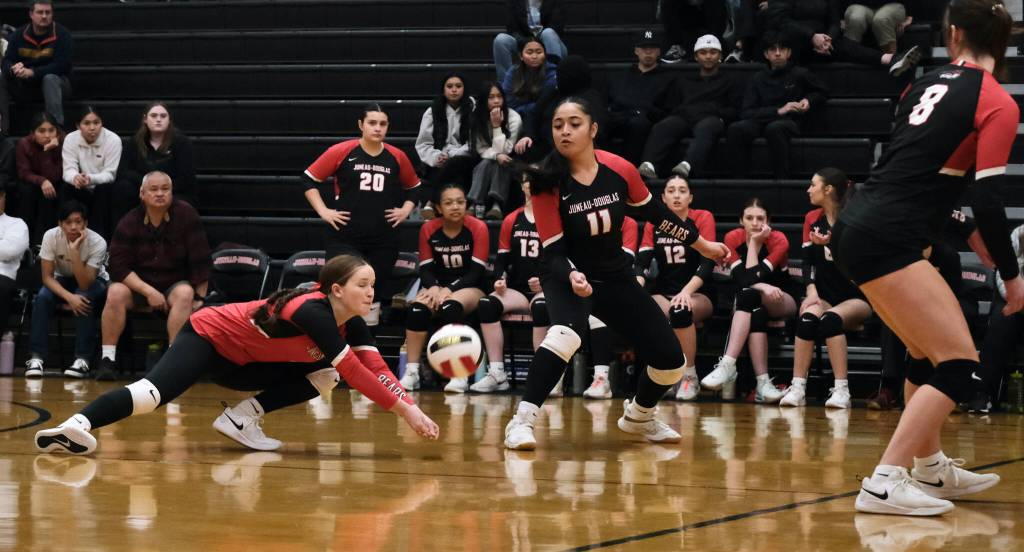 Juneau-Douglas High School: Yadaa.at Kalé juniors Cambry Lockhart digs a shot against Wasilla during the Crimson Bears three-set loss to the visiting Warriors on Saturday at the George Houston Gymnasium. (Klas Stolpe/Juneau Empire)