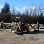 Tom Mattice, Juneaus emergency programs manager, uses a loader to help residents fill sandbags at Melvin Park on Sunday afternoon. The city is distributing 75,000 sandbags for free, with sand available at the park and the Thunder Mountain Middle School parking lot. (Mark Sabbatini / Juneau Empire)