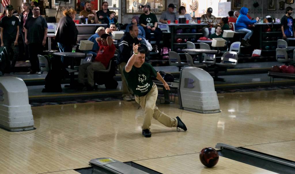 CJ Umbs delivers a ball during the Juneau Special Olympics bowling games Sunday at Pinz Bowling Alley. (Klas Stolpe/Juneau Empire)