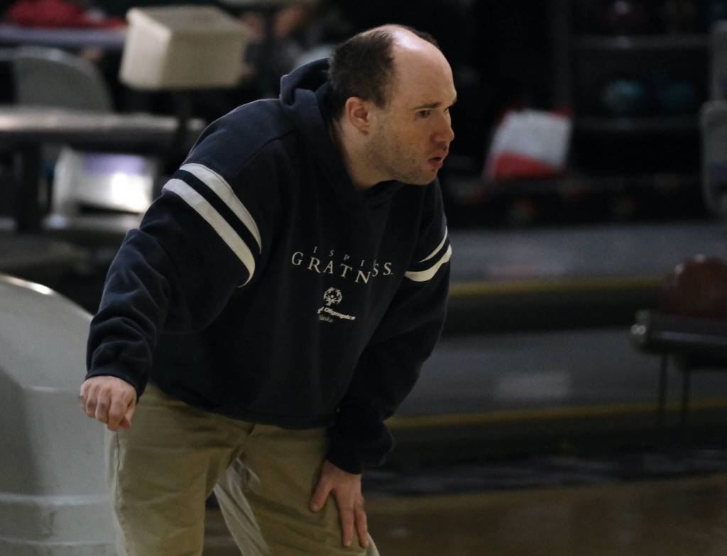 Jake Lewis watches his ball during the Juneau Special Olympics bowling games Sunday at Pinz Bowling Alley. (Klas Stolpe/Juneau Empire)