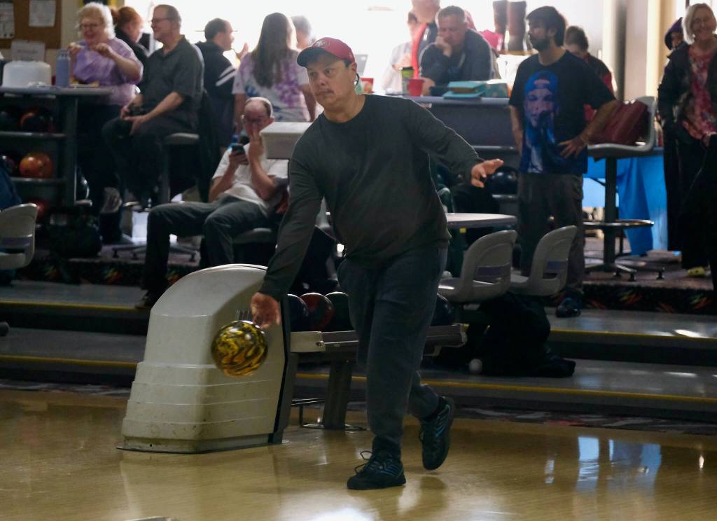 Leroy George delivers a ball during the Juneau Special Olympics bowling games Sunday at Pinz Bowling Alley. (Klas Stolpe/Juneau Empire)