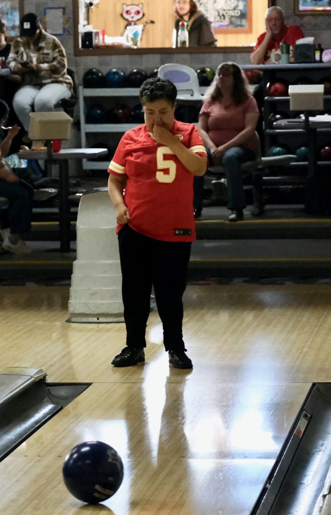 Bobbi Colbert watches her delivered ball move down the lane during the Juneau Special Olympics bowling games Sunday at Pinz Bowling Alley. (Klas Stolpe/Juneau Empire)