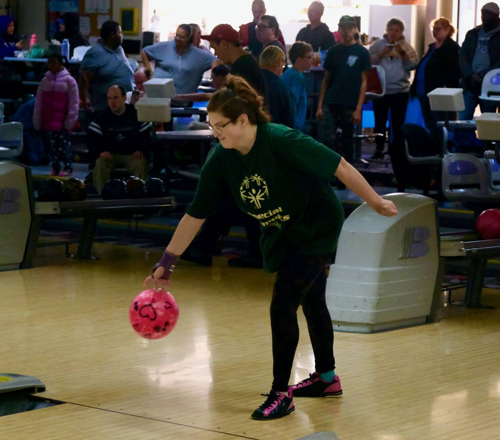 Amanda Lambert delivers her unique ball during the Juneau Special Olympics bowling games Sunday at Pinz Bowling Alley. (Klas Stolpe/Juneau Empire)