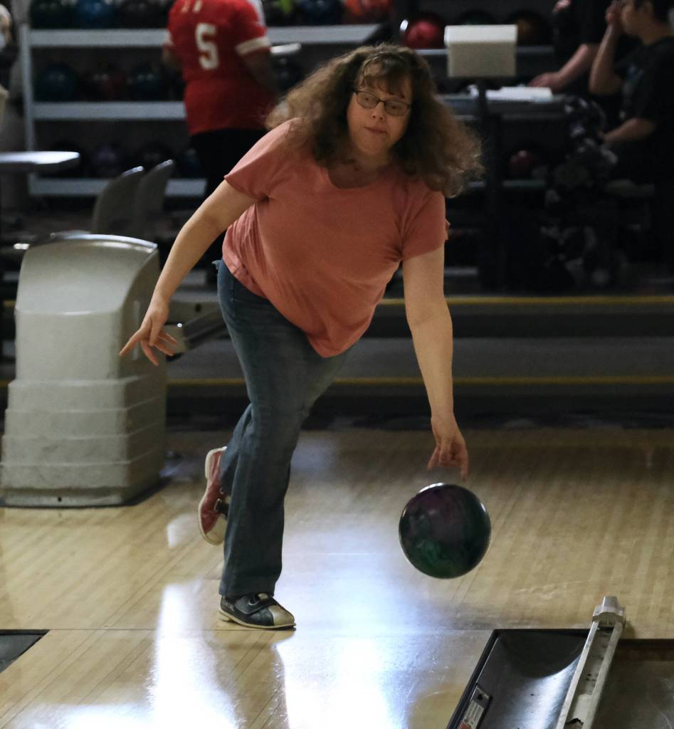Michelle Boster delivers a ball during the Juneau Special Olympics bowling games Sunday at Pinz Bowling Alley. (Klas Stolpe/Juneau Empire)