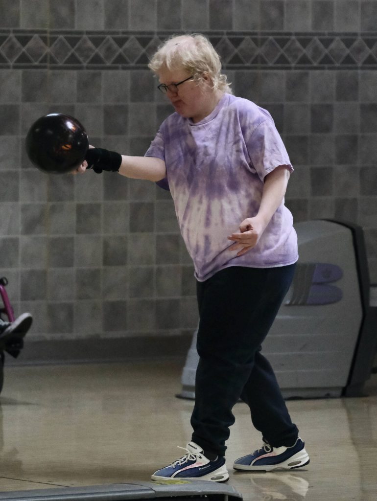 Amanda Savikko lines up her delivery during the Juneau Special Olympics bowling games Sunday at Pinz Bowling Alley. (Klas Stolpe/Juneau Empire)