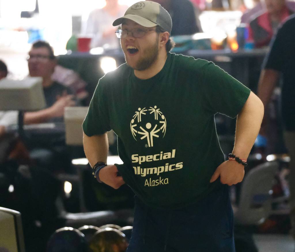 Keehan Lee celebrates his delivery during the Juneau Special Olympics bowling games Sunday at Pinz Bowling Alley. (Klas Stolpe/Juneau Empire)