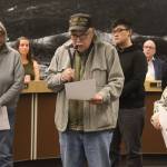 Clarence Butch Laiti (center), president of the Douglas Indian Association, acknowledges an apology from the City and Borough of Juneau during an Assembly meeting Monday at City Hall for its role in the burning of the Douglas Indian Village in 1962. (Mark Sabbatini / Juneau Empire)