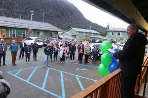 Jonathan Swinton, executive director of Gastineau Human Services, presides over a ribbon-cutting ceremony for the opening of a remodeled behavioral health clinic at the nonprofit organizations Lemon Creek campus on Thursday. (Mark Sabbatini / Juneau Empire)