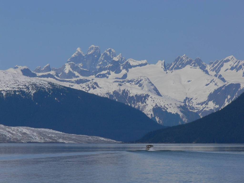 A view of a boat passing near Taku Glacier with Devils Paw mountain in the distance. (Photo courtesy of Steve Gilbertson)