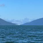 A photo showing 8,584-foot Devils Paw from the Taku River inlet south of Juneau. The solitary rock spike called Michaels Sword is visible to the left. Devils Paw is designated as Boundary Peak 93 on the map of approximately 185 border peaks from Hyder, Alaska, and Stewart, British Columbia, north to Mount Saint Elias at the 141st meridian. (Photo courtesy of Cathy Connor)