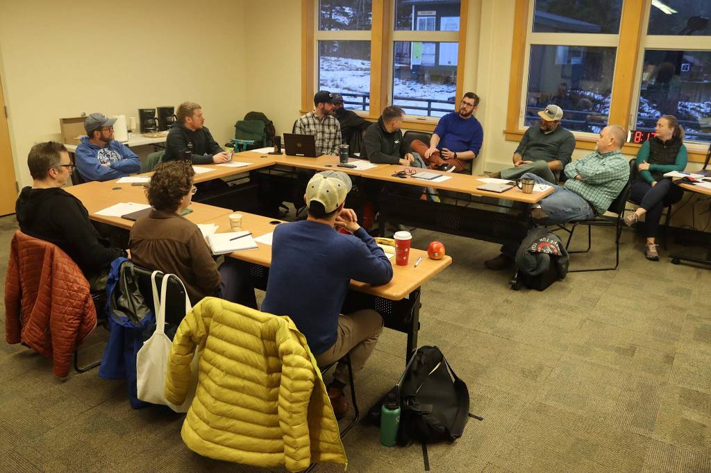 Eaglecrest Ski Areas board of directors, management and other officials gather for a board retreat Saturday at the Porcupine Lodge. (Mark Sabbatini / Juneau Empire)