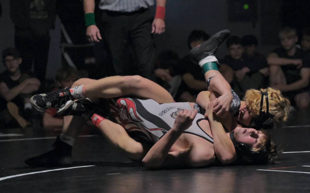Ketchikan senior Titan Linne secures Wrangell junior Ben Houser during their 130-pound title match on Saturday at the Southeast Showdown Wrestling Tournament in Juneaus George Houston Gymnasium. Linne would win by Technical Fall 15-0. (Klas Stolpe / Juneau Empire)