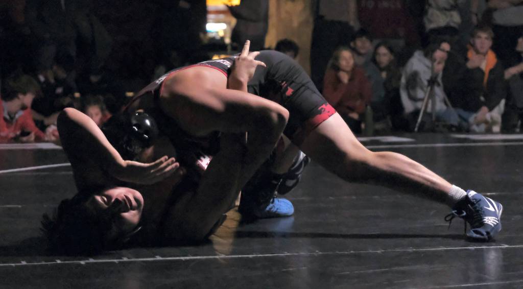 Juneau-Douglas High School: Yadaa.at Kalé senior Hayden Aube pins junior teammate Alexzondro Marx-Beierly in the 160-pound title match on Saturday at the Southeast Showdown Wrestling Tournament in Juneau's George Houston Gymnasium. (Klas Stolpe / Juneau Empire)