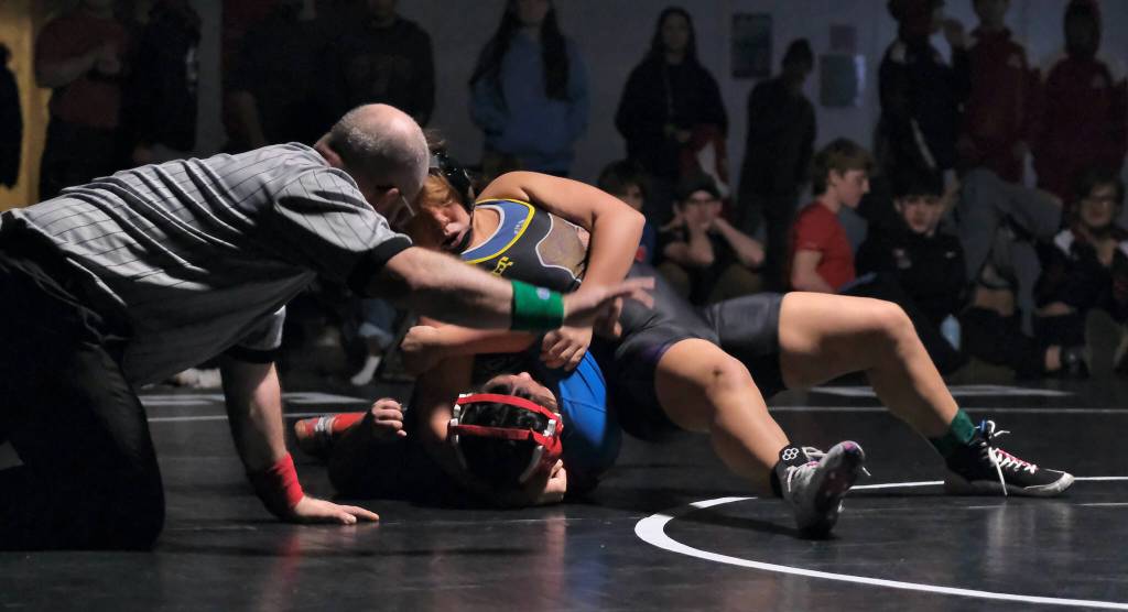 Hydaburg's Clara Frank pins Kake freshman Sassy Sharclane-Wooton in the girls 235-pound title match on Saturday at the Southeast Showdown Wrestling Tournament in Juneau's George Houston Gymnasium.  (Klas Stolpe / Juneau Empire)
